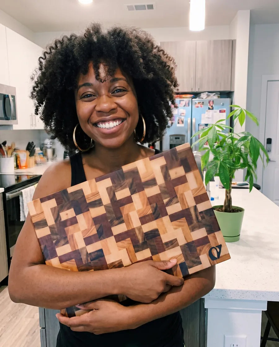 Home cook holding a Notorious end-grain chopping board