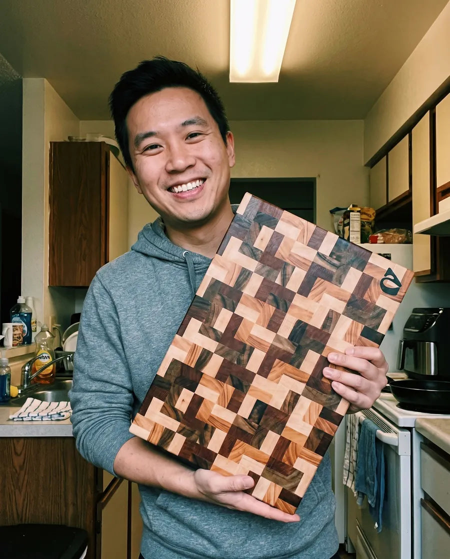 Home cook holding a Notorious end-grain chopping board